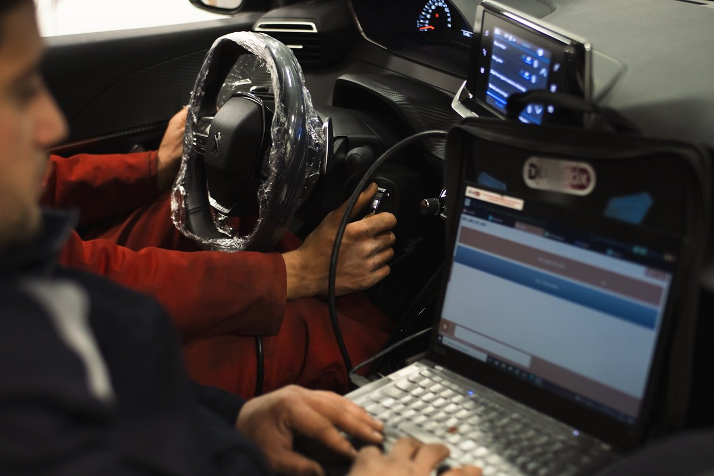 Hands-on tuning session with a laptop inside the vehicle