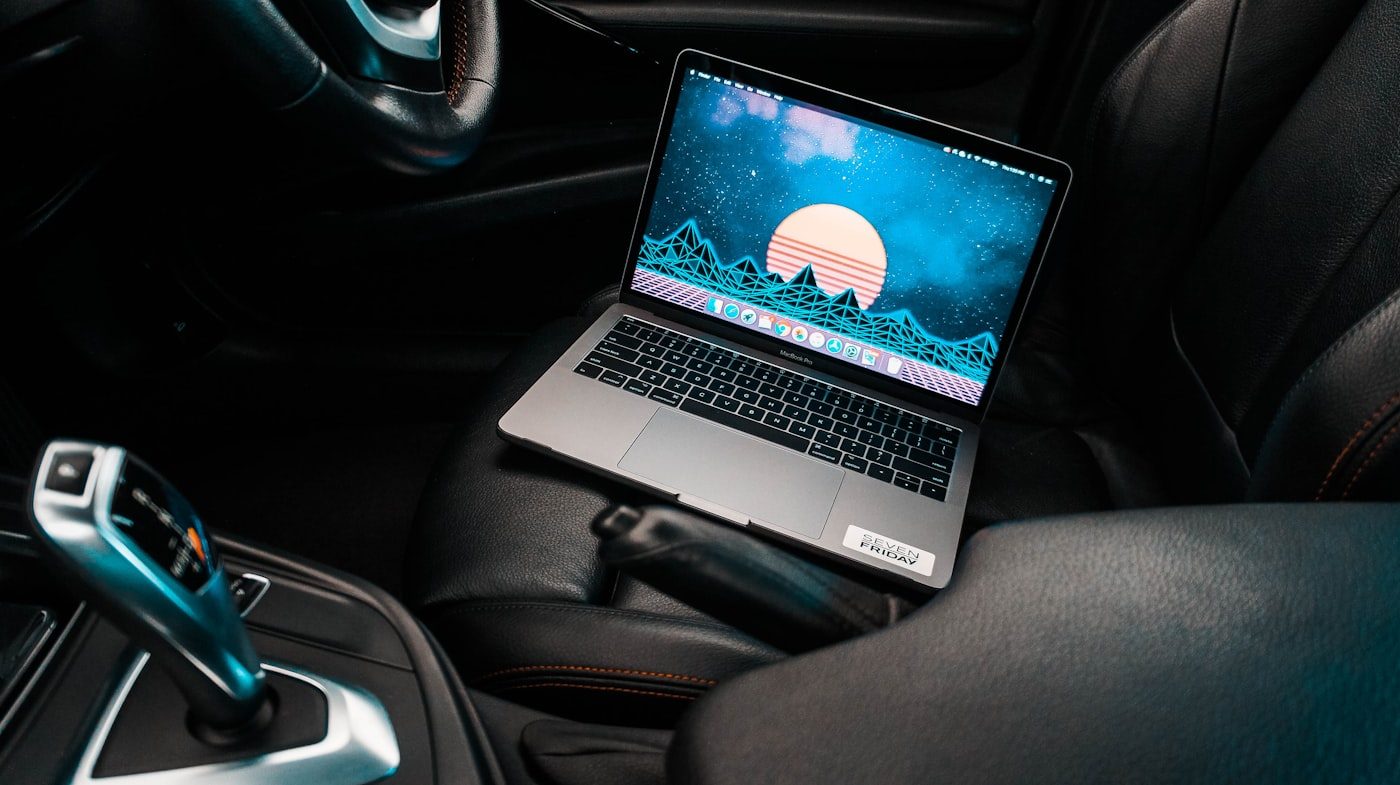 Laptop with tuning software on a car seat